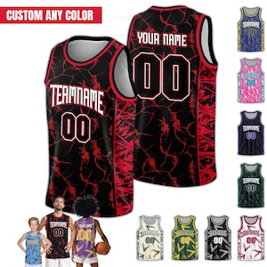 May include: Black and red basketball jersey with the text "TEAMNAME" and the number "00" on the front. The back of the jersey has the text "YOUR NAME" and the number "00". The image also shows several other jersey color options.