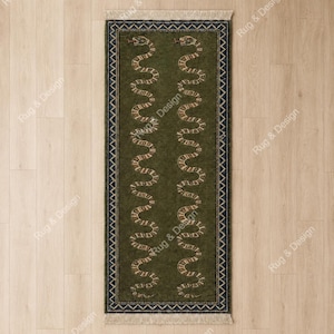 May include: A rectangular area rug in a deep olive green color featuring two vertical, wavy, light-colored snake patterns. The rug is framed by a dark border with a repeating geometric zigzag design and finished with short fringe at both ends.