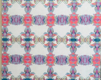 May include: A white rug with a repeating pattern of colorful abstract floral designs in shades of pink, blue, green, and purple.