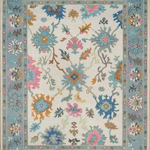 Hand-Knotted Wool Oushak Rug: Beige, Blue, and Ivory Turkish Rug