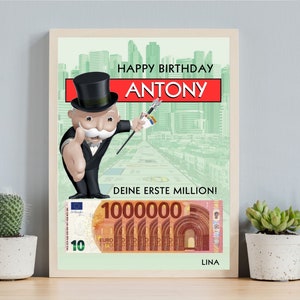 May include: A birthday card featuring a cartoon Monopoly Man holding a top hat and cane. The card has a red background with the text "Happy Birthday ANTONY" and "Deine erste Million!" with a 10 Euro bill in the bottom right corner. The card is signed "LINA".