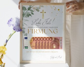 May include: A framed print with a white background and green foliage. The print features a gold cross, the text "Liebe Jule!" and "HERZLICHEN GLÜCKWUNSCH ZUR FIRMUNG", a mock-up of a 1,000,000 euro bill, and the text "VIEL SPASS MIT DEINER ERSTEN MILLION!" and "Gely wort Pack".