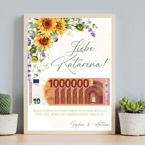 May include: A white card with a floral design and a picture of a 1,000,000 euro bill. The card says "Liebe Katarina!" and "Herzlichen Glückwunsch zum Geburtstag und viel Spaß mit deiner ersten Million!"  The card is signed "Sophia & Antuan".