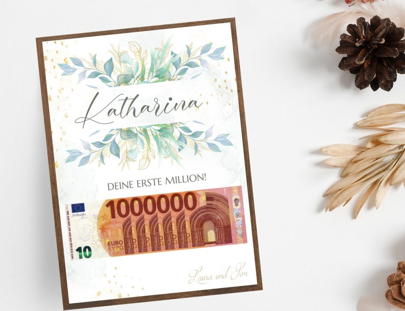 May include: A white card with a green and blue floral design. The card says "Katharina" in cursive and "Deine erste Million!" with a 10 euro bill that says "1000000" on it. The card is signed "Laura and Tom".