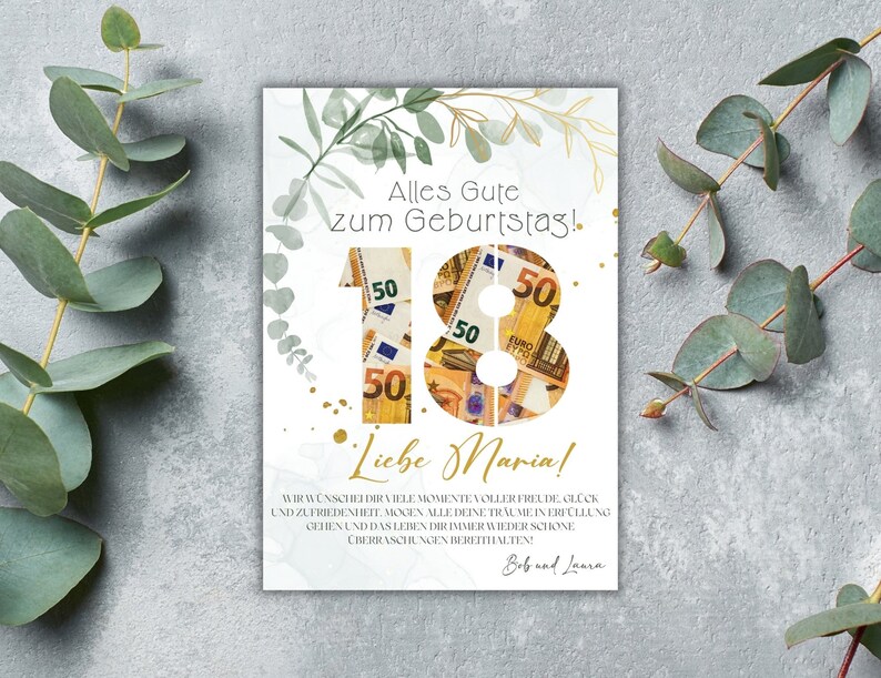 May include: A white card with green foliage and gold glitter accents. The number 18 is made of euro bills. The text reads "Alles Gute zum Geburtstag!" and "Liebe Maria!"  "Wir w&uuml;nschen dir viele Momente voller Freude, Gl&uuml;ck und Zufriedenheit. M&ouml;gen alle deine Tr&auml;ume in Erf&uuml;llung gehen und das Leben dir immer wieder sch&ouml;ne &Uuml;berraschungen bereithalten. Bob und Laura"