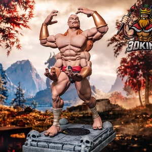 Puede incluir: Una figura detallada de un personaje masculino musculoso, desnudo, con un taparrabos rojo y brazaletes dorados. La figura está en posición de combate, con los brazos levantados y las manos abiertas. La figura está de pie sobre una base de piedra con calaveras y una plataforma circular negra.