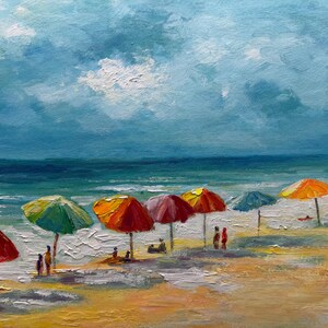 May include: Oil painting depicting a beach scene with vibrant parasols. The sky blends blue and white, with a deep blue ocean. Figures are relaxing on the sandy beach beneath the colourful parasols.