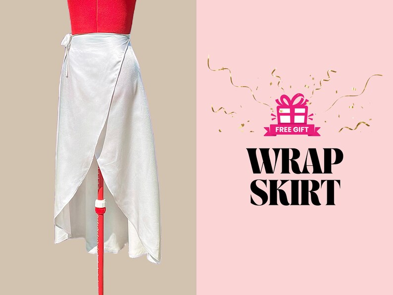 May include: A white wrap skirt with a tie closure. The skirt is on a mannequin and the background is pink with gold confetti and the text "FREE GIFT" and "WRAP SKIRT".