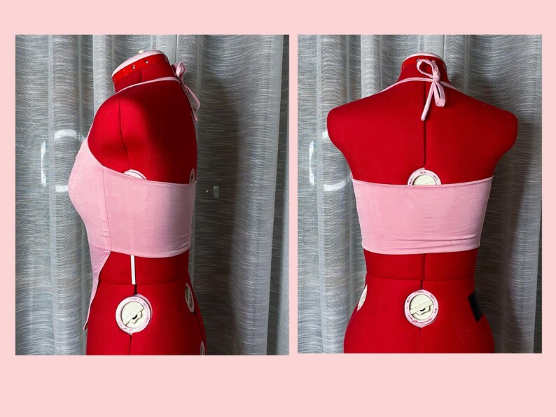 May include: Pink halter top with a thin strap design. The top is made of a soft, stretchy fabric and has a cropped fit.