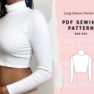 May include: A white long-sleeve crop top sewing pattern in PDF format. The pattern is for sizes XXS-XXL. The image shows a model wearing the finished garment.