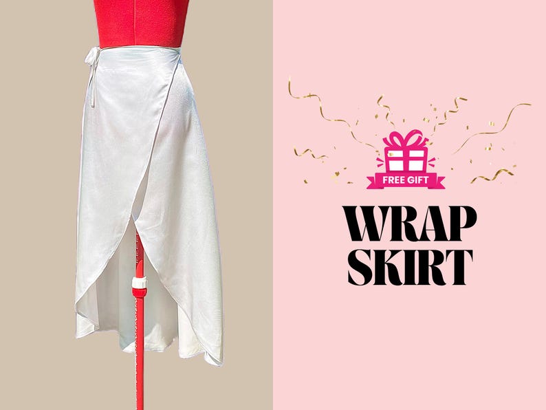 May include: A white wrap skirt with a tie closure. The skirt is on a mannequin and the background is pink with gold confetti and the text "FREE GIFT" and "WRAP SKIRT".