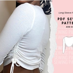 May include: A white long-sleeve shirt with a cinched waist and a tie detail at the side. The shirt is shown on a model. The image includes the text "Long Sleeve Pattern", "PDF SEWING PATTERN", and "XXS-XXL".
