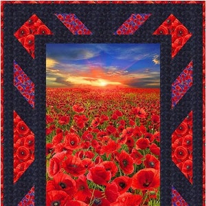 May include: A quilt block featuring a blue background with a central red poppy field. The field is bordered by red and blue diamond shapes.