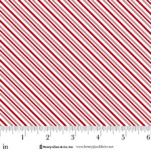 May include: White fabric with diagonal red stripes. The stripes are evenly spaced and vary in width, creating a visually dynamic pattern. A ruler in inches is at the bottom of the image.