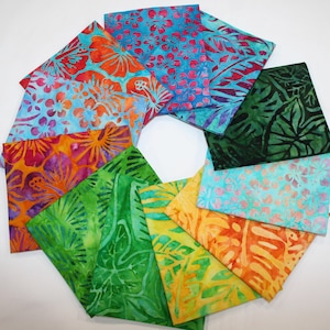 May include: A collection of 10 colorful fabric squares with various floral and leaf patterns. The fabrics are in shades of blue, green, orange, yellow, pink, and purple.