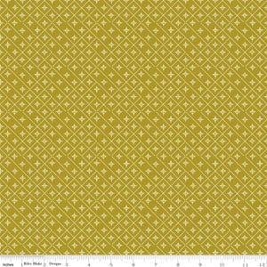 May include: A mustard yellow fabric featuring a repeating white geometric pattern of dashed diagonal lines forming a diamond grid, with small four-pointed star shapes centered within each diamond. A ruler at the bottom shows 12 inches.