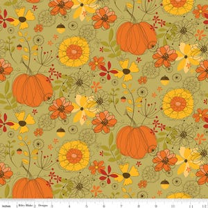 May include: A fabric pattern featuring orange pumpkins, yellow and orange flowers, and small brown acorns on a muted olive green background. The design includes thin black line art of stems and circular floral motifs. A 12-inch ruler is visible.