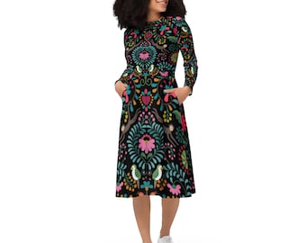 May include: A black midi dress with a colorful floral and animal print. The dress has long sleeves and pockets.