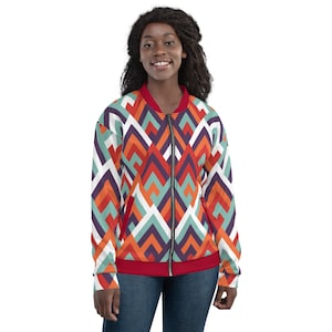 Puede incluir: Una chaqueta bomber con estampado geométrico rojo, blanco, naranja, azul y morado con cierre de cremallera.