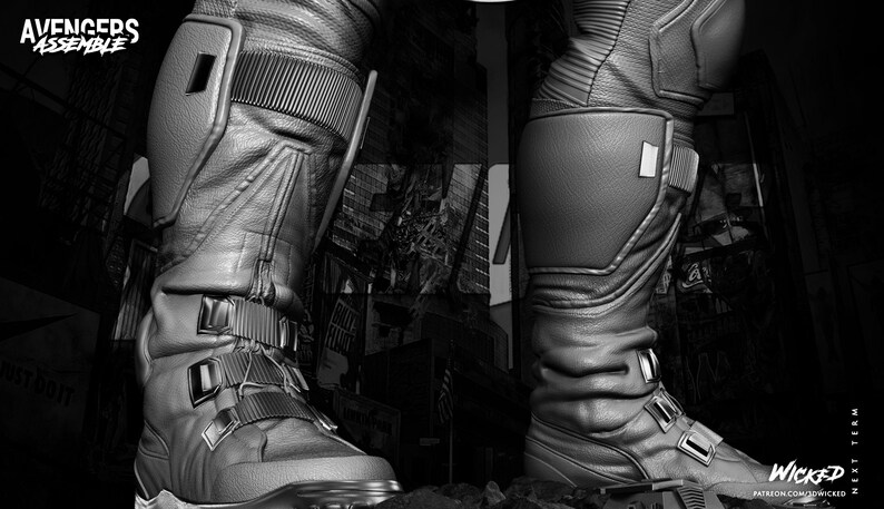 May include: Black and white image of futuristic boots with multiple straps and panels. The boots have a textured appearance and are detailed with various design elements. The text "AVENGERS ASSEMBLE" is visible in the upper left corner.