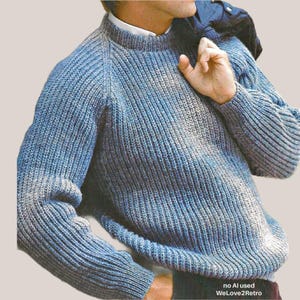 May include: A blue ribbed knit sweater with long sleeves and a crew neckline. The sweater features a textured, chunky yarn construction with subtle variations in blue tones. The text "no AI used WeLove2Retro" is printed in the bottom right corner.