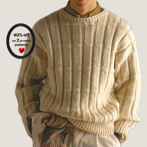 Peut inclure: Un pull à manches longues de couleur crème avec un motif en tricot côtelé vertical et une encolure ronde. Un graphique circulaire sur le côté gauche affiche le texte 40% off on 2 or more patterns avec une icône de cœur rouge.