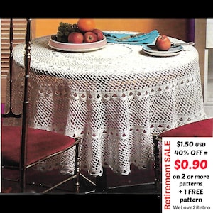 May include: A circular, cream-coloured crocheted tablecloth with a scalloped border, covering a table. The table is set with fruit and a blue napkin. The image includes text that says "Retirement SALE".