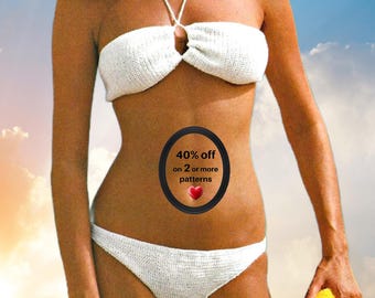 May include: A white two-piece crochet bikini set featuring a strapless top with a center tie and matching bottoms. A black oval graphic is centered on the midsection with the text 40% off on 2 or more patterns and a small red heart icon.