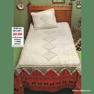 May include: A vintage crochet bedspread and pillow set. The off-white bedspread features diamond patterns and a decorative border. The bed is covered with a red and orange patterned fabric. The text on the image says "Welove2Retro".