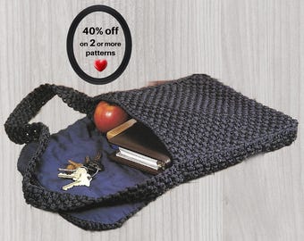 May include: A black crocheted shoulder bag with a dark blue interior lining. Inside the bag, there is a red apple, a brown leather wallet, and a set of metal keys on a ring. A circular graphic above the bag displays the text 40% off on 2 or more patterns with a red heart icon.