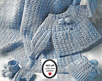 May include: A light blue crocheted baby set featuring a long-sleeve cardigan with pom-poms, a matching blanket, a pair of booties with pom-poms, and a beanie with a pom-pom. A central label displays the text 40% off on 2 or more patterns.