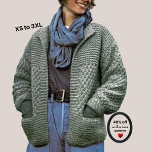 May include: A sage green chunky knit cardigan with long sleeves and two front pockets, worn over a dark shirt and blue jeans with a blue scarf. Text on the image reads XS to 3XL and 40% off on 2 or more patterns with a red heart icon.