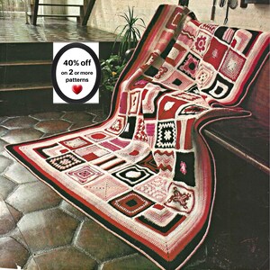 May include: A handmade crochet blanket featuring a patchwork of square motifs in shades of red, pink, white, and black. The blanket includes a circular graphic with the text 40% off on 2 or more patterns and a red heart icon.