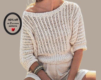 May include: A cream-colored, short-sleeved knit sweater featuring a wide boat neckline and a vertical open-stitch pattern. A black circular graphic on the left displays the text 40% off on 2 or more patterns with a small red heart icon.