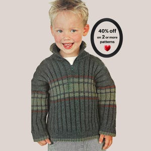 May include: A dark gray ribbed knit sweater with a quarter-zip collar and horizontal stripes in muted green and red. The sweater features a high collar and long sleeves. A circular graphic includes the text 40% off on 2 or more patterns.