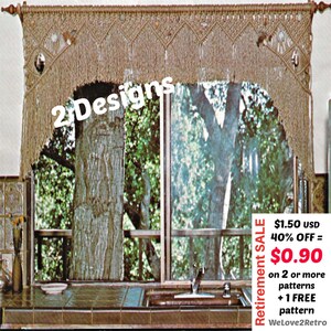 May include: A macrame window valance in a natural beige color, with a geometric design and fringe. The valance hangs above a window with a view of trees. The text "2 Designs" is visible on the valance.