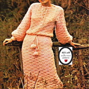 May include: A light pink two-piece knit set featuring a long-sleeved top with a drawstring neckline and a matching skirt with a drawstring waist and pom-pom accents. The set has a textured open-work pattern. Text reads: 40% off on 2 or more patterns.