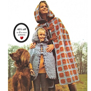 May include: Two hooded capes made of light blue and rust orange crocheted granny squares. The capes feature toggle closures and are worn over clothing. A black oval graphic with white text reads 40% off on 2 or more patterns with a red heart.