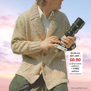May include: A beige knit cardigan with a speckled pattern, featuring a notched collar and wooden buttons. The cardigan is worn over a white shirt. The image also shows a camera with a large lens. Text on the image reads "WeLove2Retro".