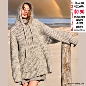 Pode incluir: Um moletom de malha cinza claro, grande, com bolso canguru e cordão. O suéter tem uma textura canelada e um capuz. A imagem inclui o texto "Retirement SALE" e "WeLove2Retro".
