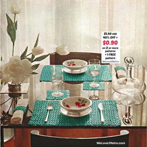 May include: A dining table setting with turquoise crocheted placemats, matching coasters, and white bowls with a red fruit design. Clear glassware and a decorative glass decanter are also present. The text "WeLove2Retro.com" is visible.