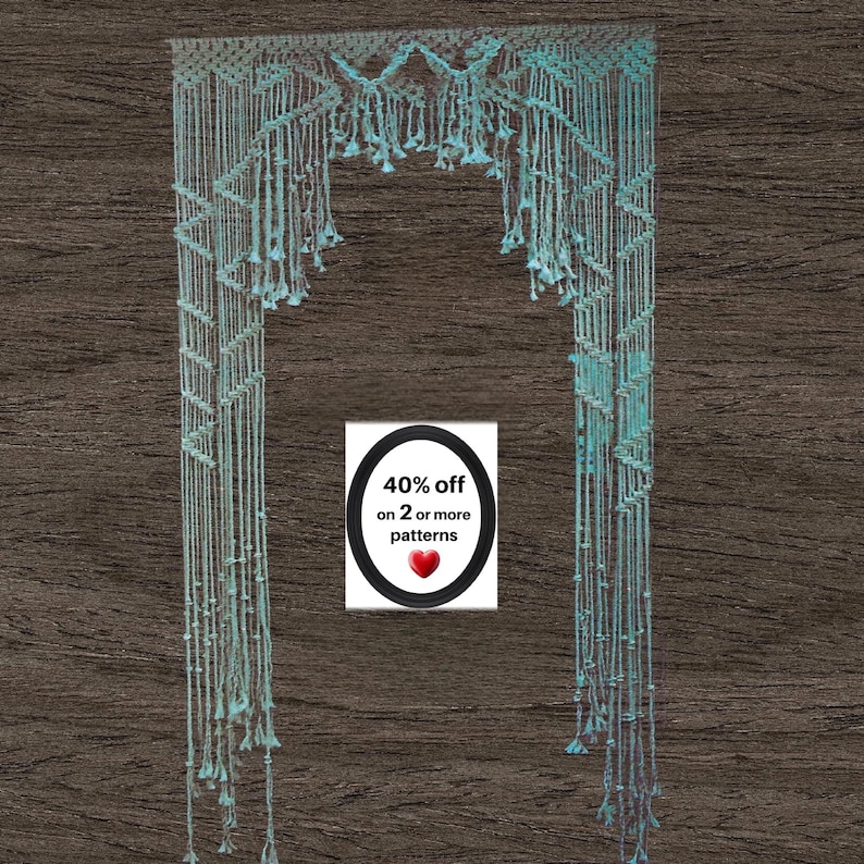 May include: A light blue macrame wall hanging featuring intricate knotted patterns and hanging fringe details. A central white rectangular sign displays the black text 40% off on 2 or more patterns with a small red heart icon below the text.