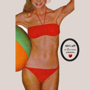 May include: A bright red two-piece bikini with a halter-style top and matching bikini bottoms. To the right, a black oval frame contains the text 40% off on 2 or more patterns with a small red heart icon below the text.