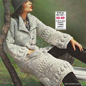 May include: A vintage knitted coat in a speckled light gray color, featuring leaf-shaped patterns on the sleeves and lower portion. The coat has a button closure and a collar. The image includes text that reads "WeLove2Retro".