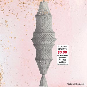 May include: A gray macrame pendant light with intricate woven patterns and a tassel at the bottom. The light fixture has a cylindrical shape with a flared top and bottom. The text on the image says "$0.90".