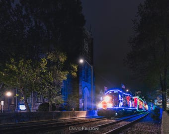 Hamilton / CPKC Holiday Train rolling pass MacNab St. Presbyterian Church