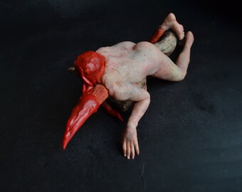 Deep red sculpture, Realistic tiny sculpture, Contemporary art piece for collection, hyperrealism, Surreal figure, conceptual artwork