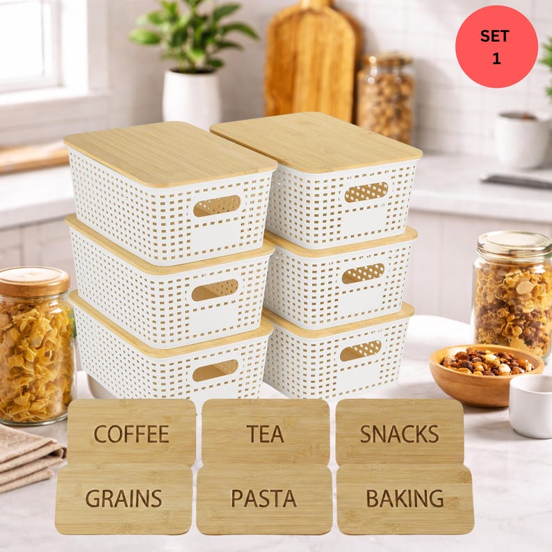 May include: A set of six white plastic storage bins with bamboo lids. The bins have a perforated design and integrated handles. Six wooden labels are included, with text that reads "Coffee", "Tea", "Snacks", "Grains", "Pasta", and "Baking".