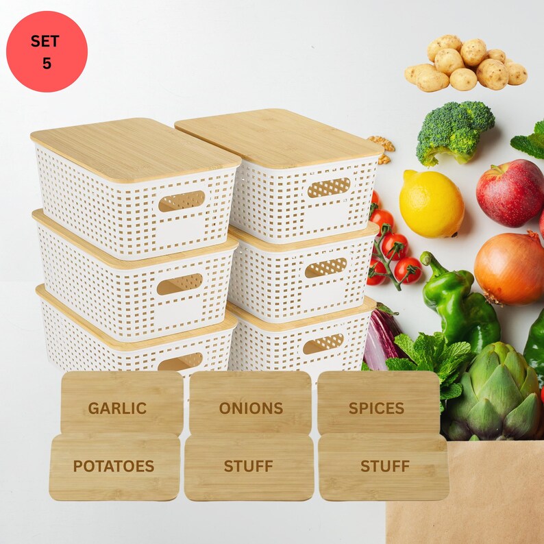 May include: A set of five white plastic storage bins with bamboo lids. The bins have a woven pattern and integrated handles. Also included are wooden labels for garlic, onions, spices, potatoes, and other items. Fresh produce is arranged around the bins.