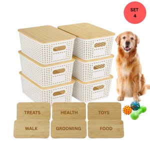 May include: A set of four white plastic storage bins with bamboo lids, ideal for pet supplies. The bins have a rectangular shape with a perforated design. Includes wooden labels for treats, health, toys, walk, grooming, and food. A golden retriever sits next to the bins.